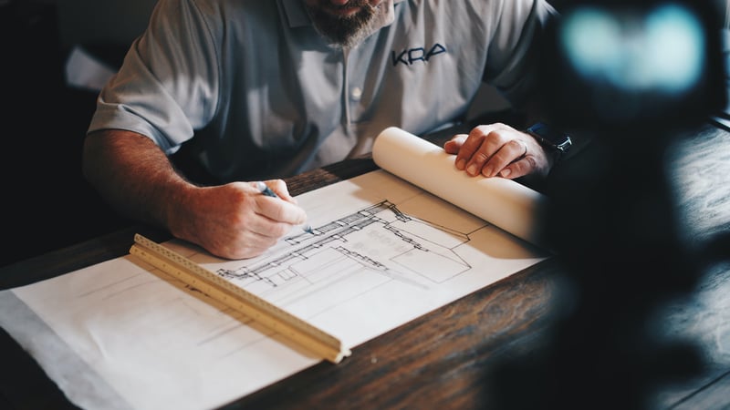 Man drawing architecture plan