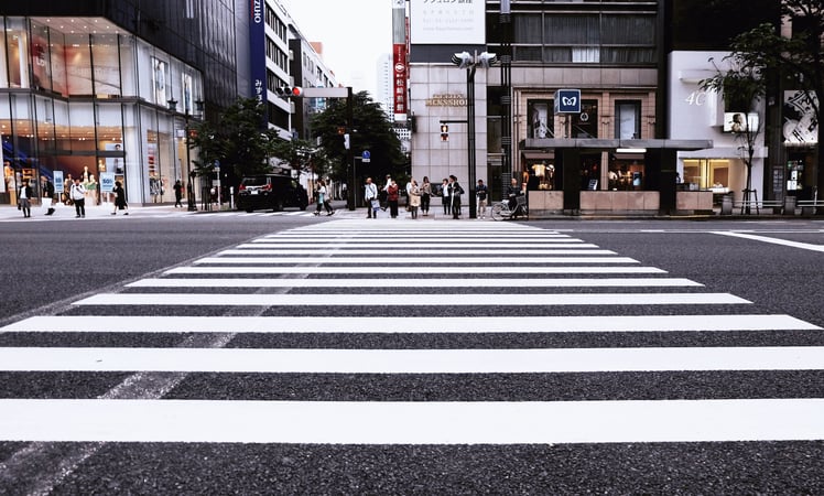 Street crossing in a shopping district symbolising trust