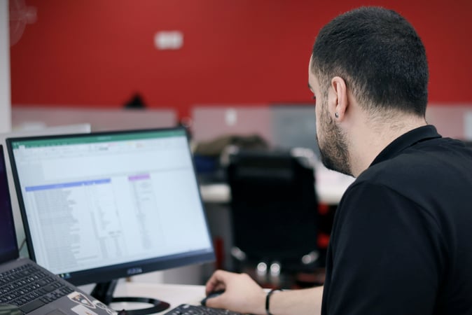 man working with data on laptop