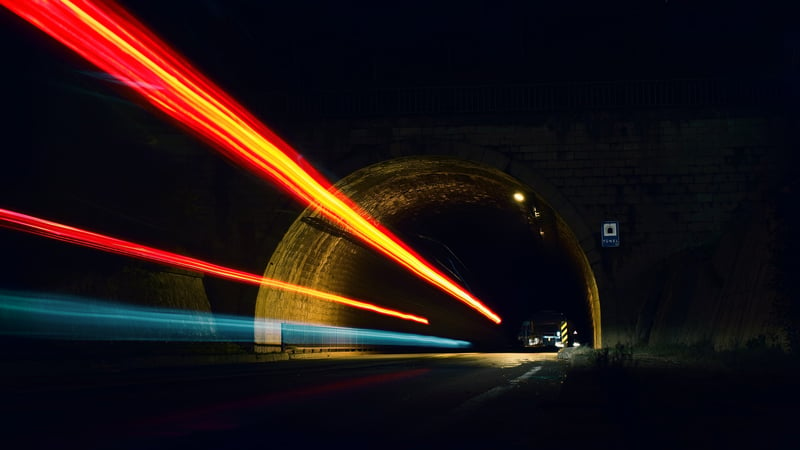 lights moving through a tunnel (How to deliver data-driven transformation projects 3x faster with Clover blog)
