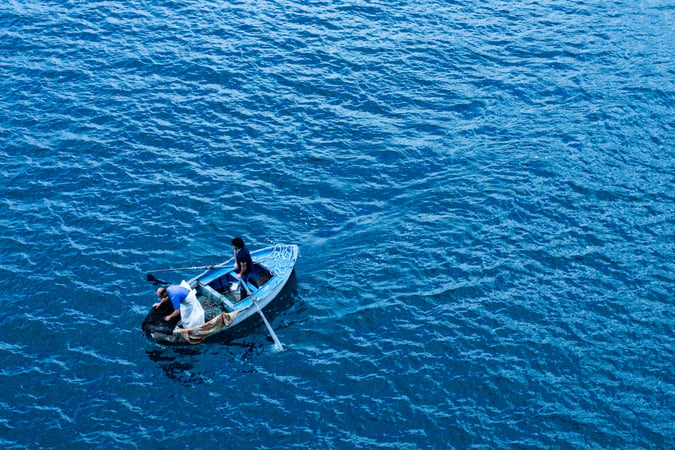 Two men in a small fishing boat
